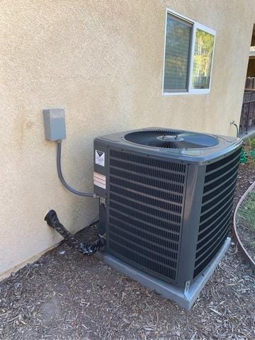AC condenser unit installed outside a home in San Bernardino, CA, showcasing professional HVAC installation for optimal heating and cooling efficiency.