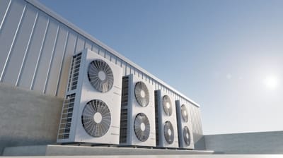 Air conditioning units installed on a rooftop, emphasizing HVAC maintenance and efficiency for improved indoor air quality.